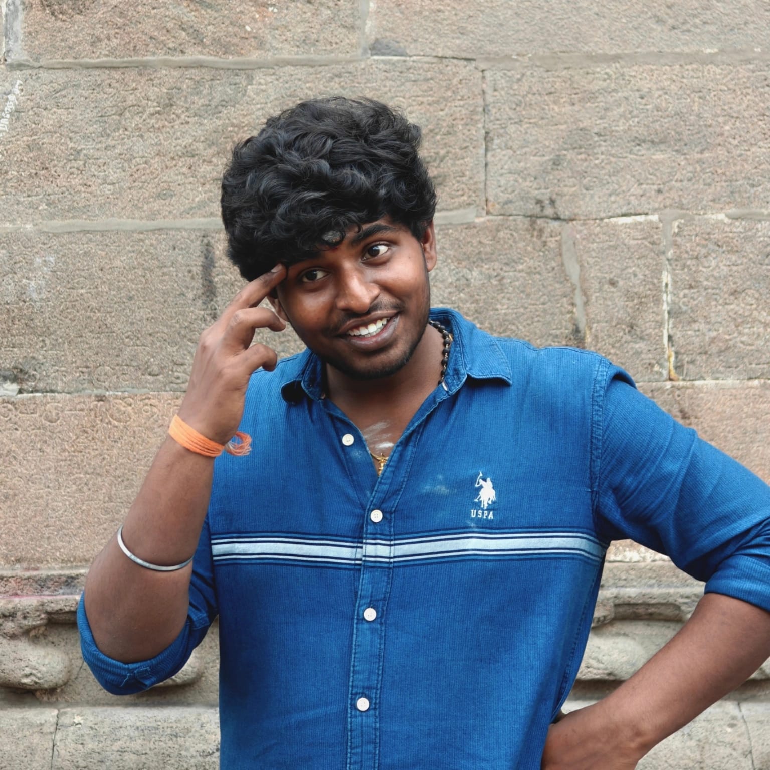 Gowtham Blue Shirt Temple Wall